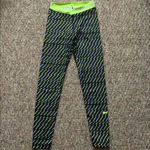 Nike pro leggings with yellow and white design.